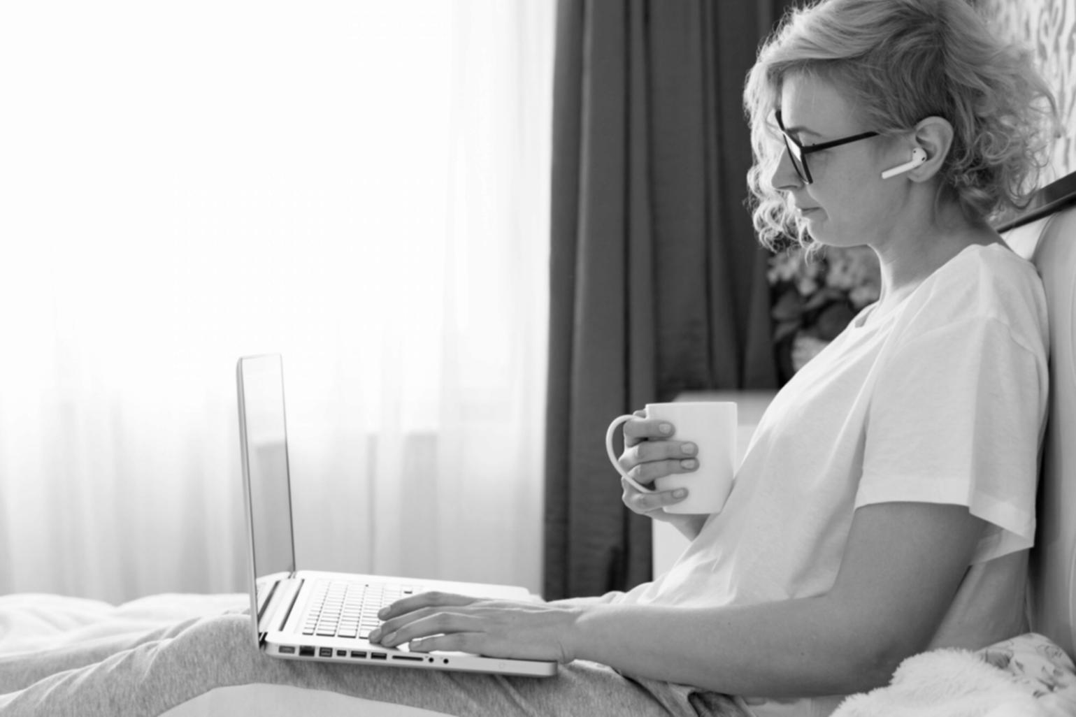 Budget tracking workspace with financial documents and laptop